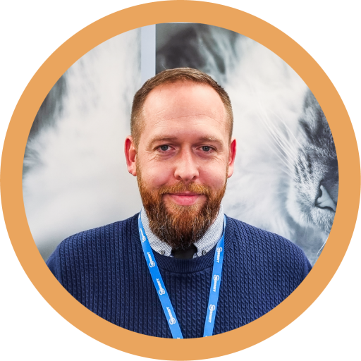 This is a photograph of Gary Sheils. He has brunette hair and is smiling at the camera.