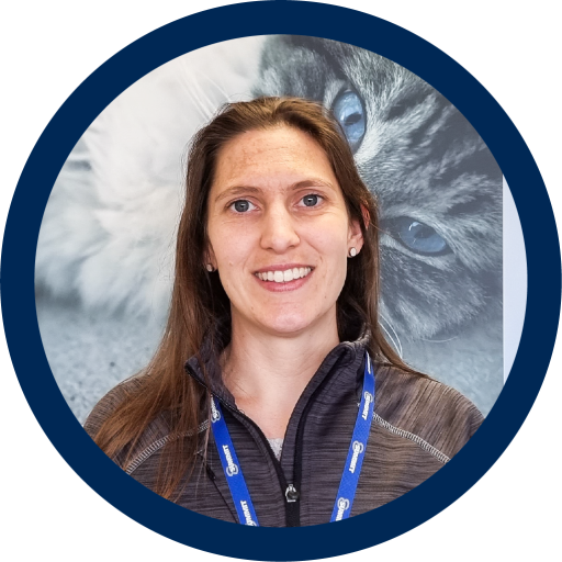 This is a photograph of Jo Brett. She has brunette hair and is smiling at the camera.